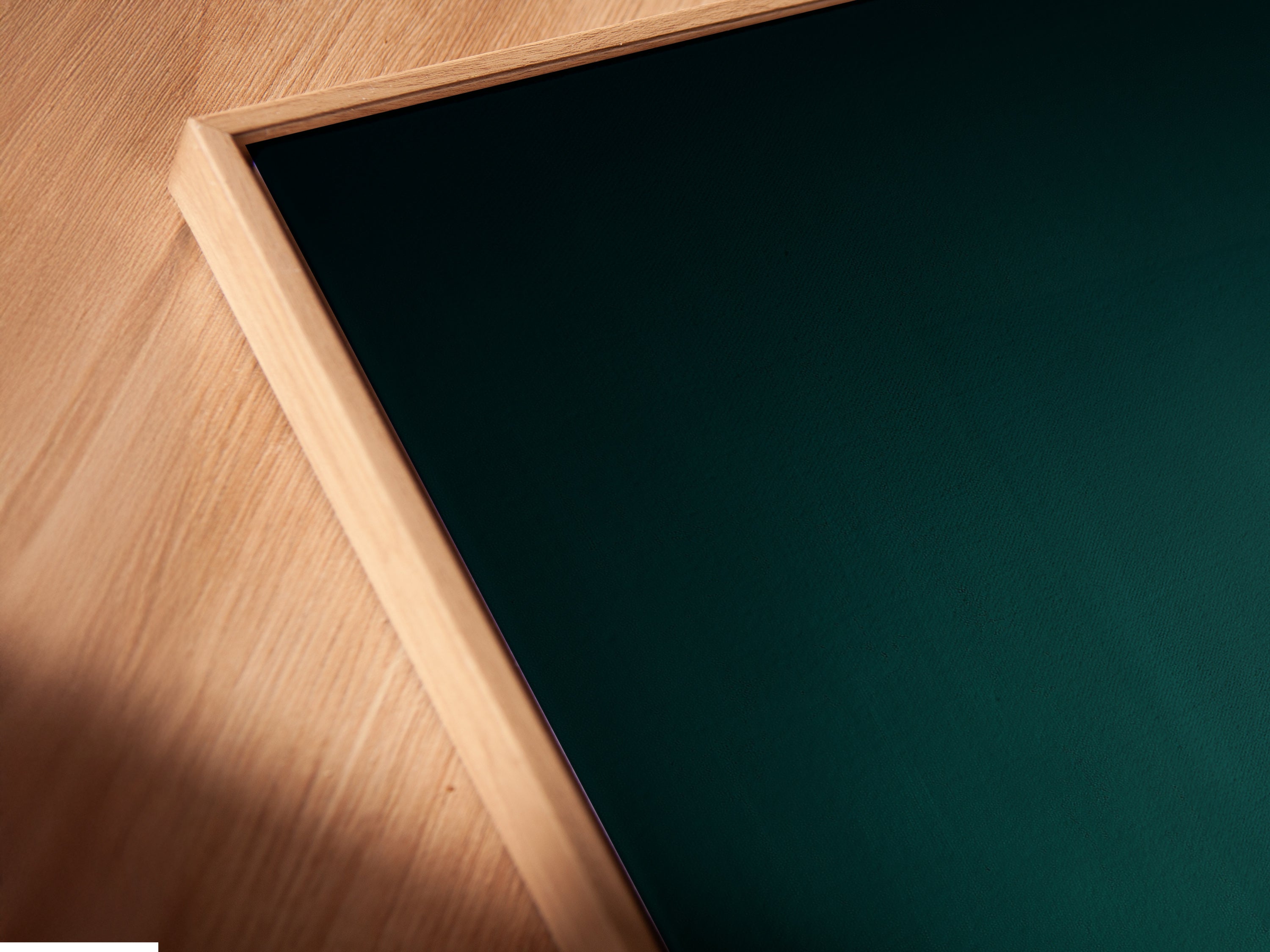 View a close-up of canvas print. It's set in a floating frame. The teal sports car art is modern. It will elevate your wall decor.