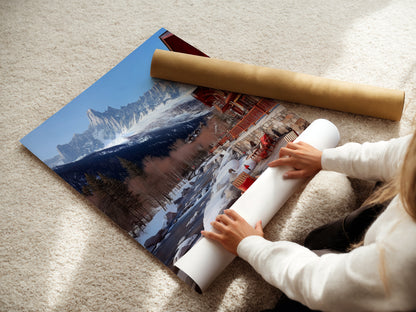 A woman carefully rolls a fine art poster paper. The paper features a mountain chalet artwork print. This snowy Alps landscape is perfect for rustic decor. Ideal for those seeking lodge artwork for cabin decor. The fine art poster captures winter's beauty.