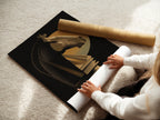 A woman carefully rolls a fine art poster paper. The poster paper is high-quality and archival. It ensures the artwork looks its best. The art is protected during shipping and handling. Fine art paper enhances the artwork's longevity and beauty.