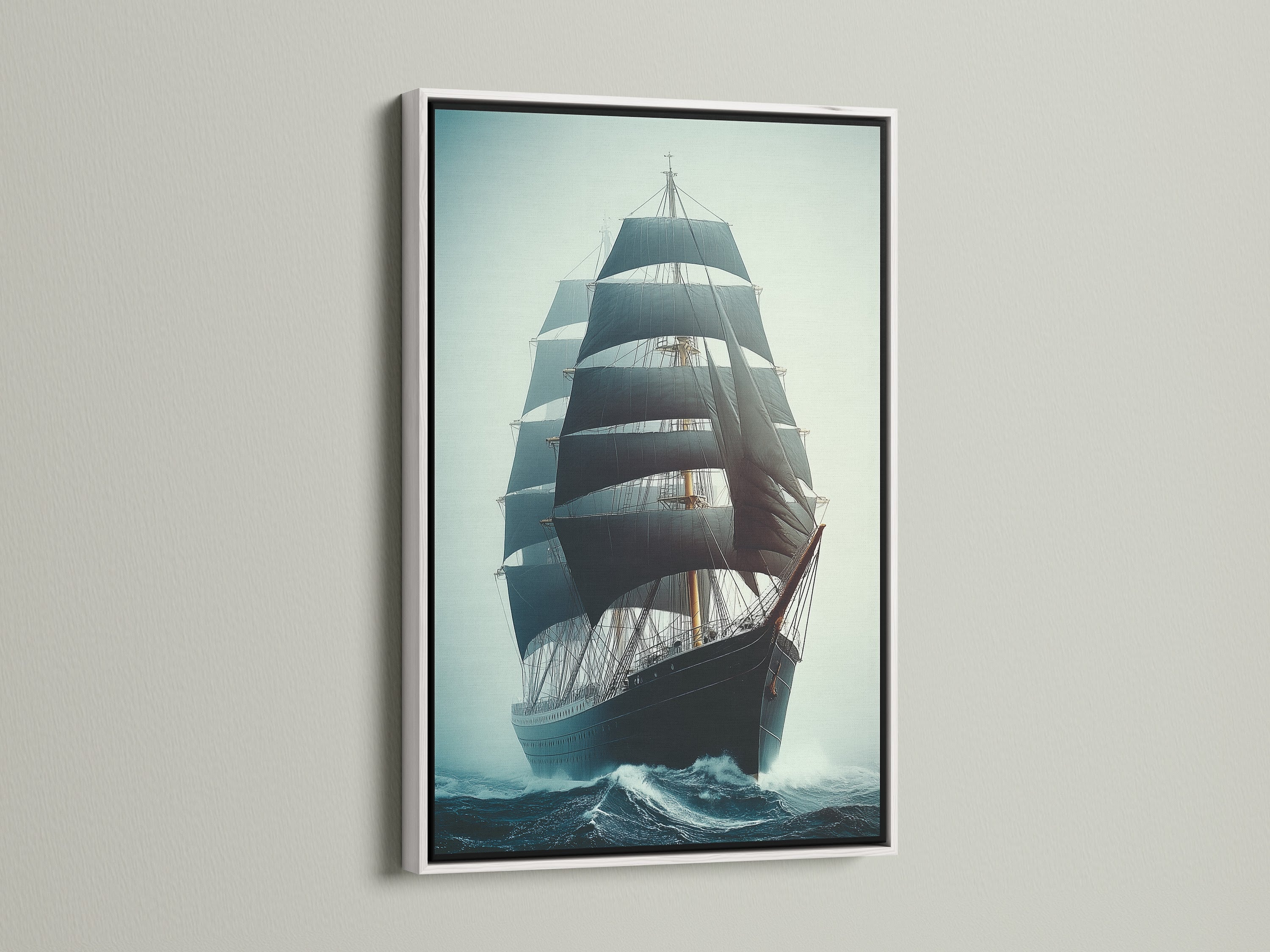 Sailing Ship Canvas Print with a white frame. This nautical wall art features a vintage ship. The white frame enhances the teal and navy tones. It's ideal for coastal style decor.