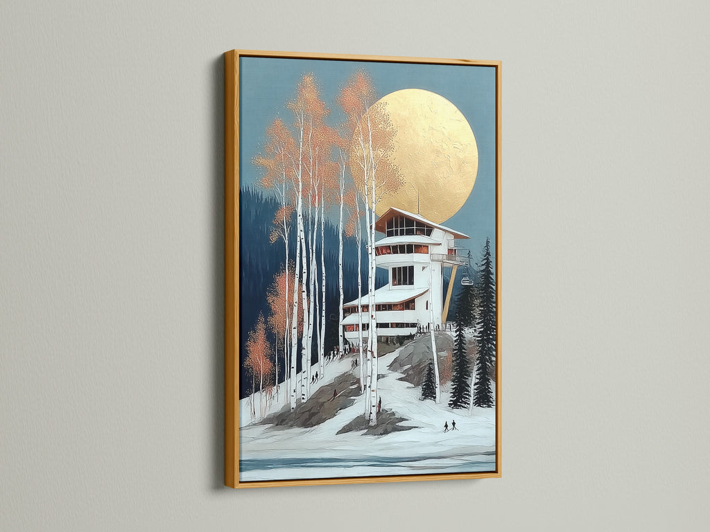 Winter Ski Lodge art print in a gold frame. The metallic frame adds a luxurious touch. The artwork features a snowy mountain landscape. It's perfect for adding elegance to any room. This print enhances ski lodge decor. Bring a touch of alpine charm to your home.