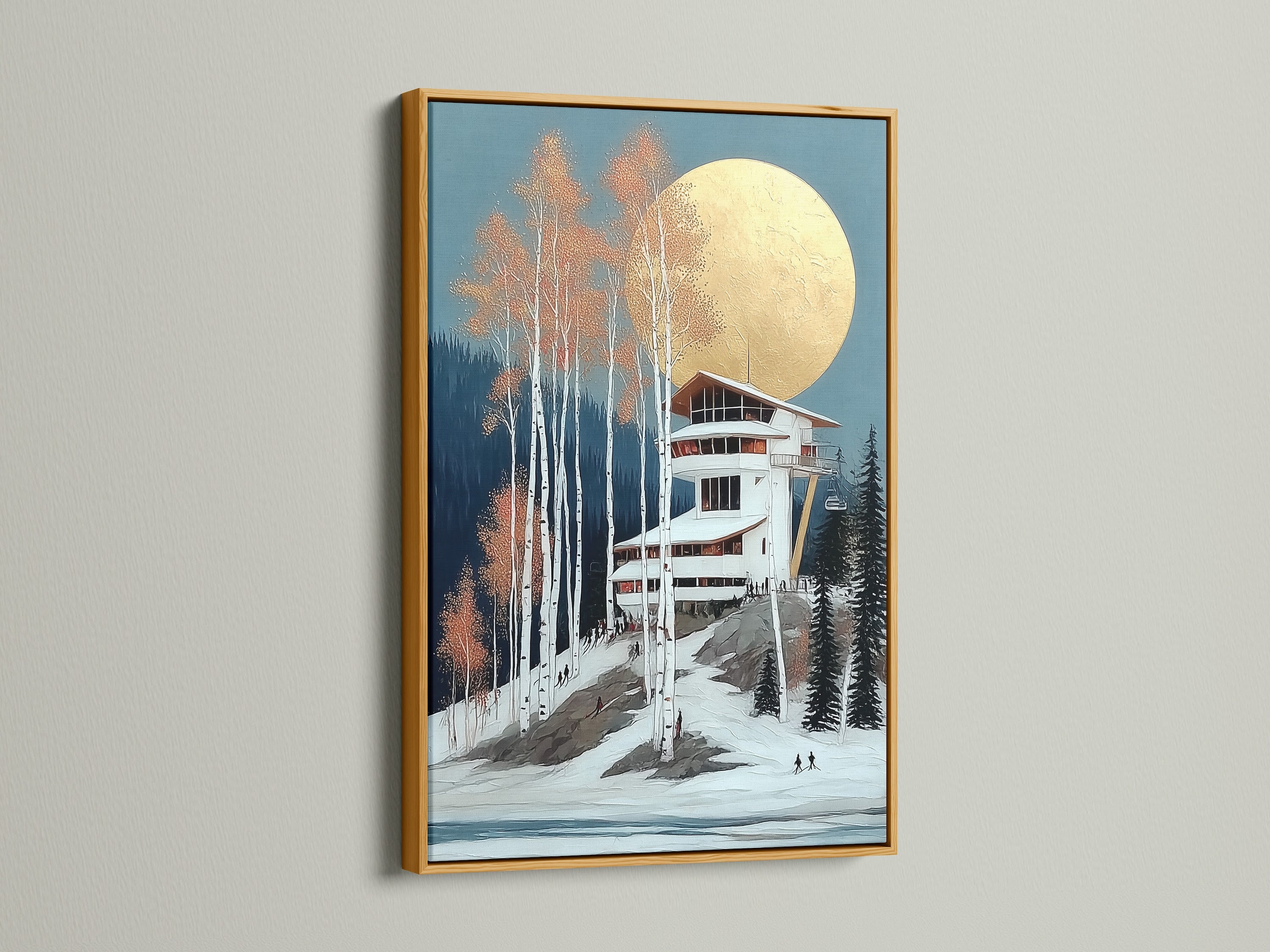 Winter Ski Lodge art print in a gold frame. The metallic frame adds a luxurious touch. The artwork features a snowy mountain landscape. It's perfect for adding elegance to any room. This print enhances ski lodge decor. Bring a touch of alpine charm to your home.