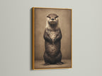 Gold frame displaying an otter art print. This animal art print is a cute wildlife canvas. It is perfect for nursery wall decor and bathroom wall art. The otter artwork adds charm to any room. A great gift for animal lovers. This whimsical art complements contemporary and Scandinavian styles