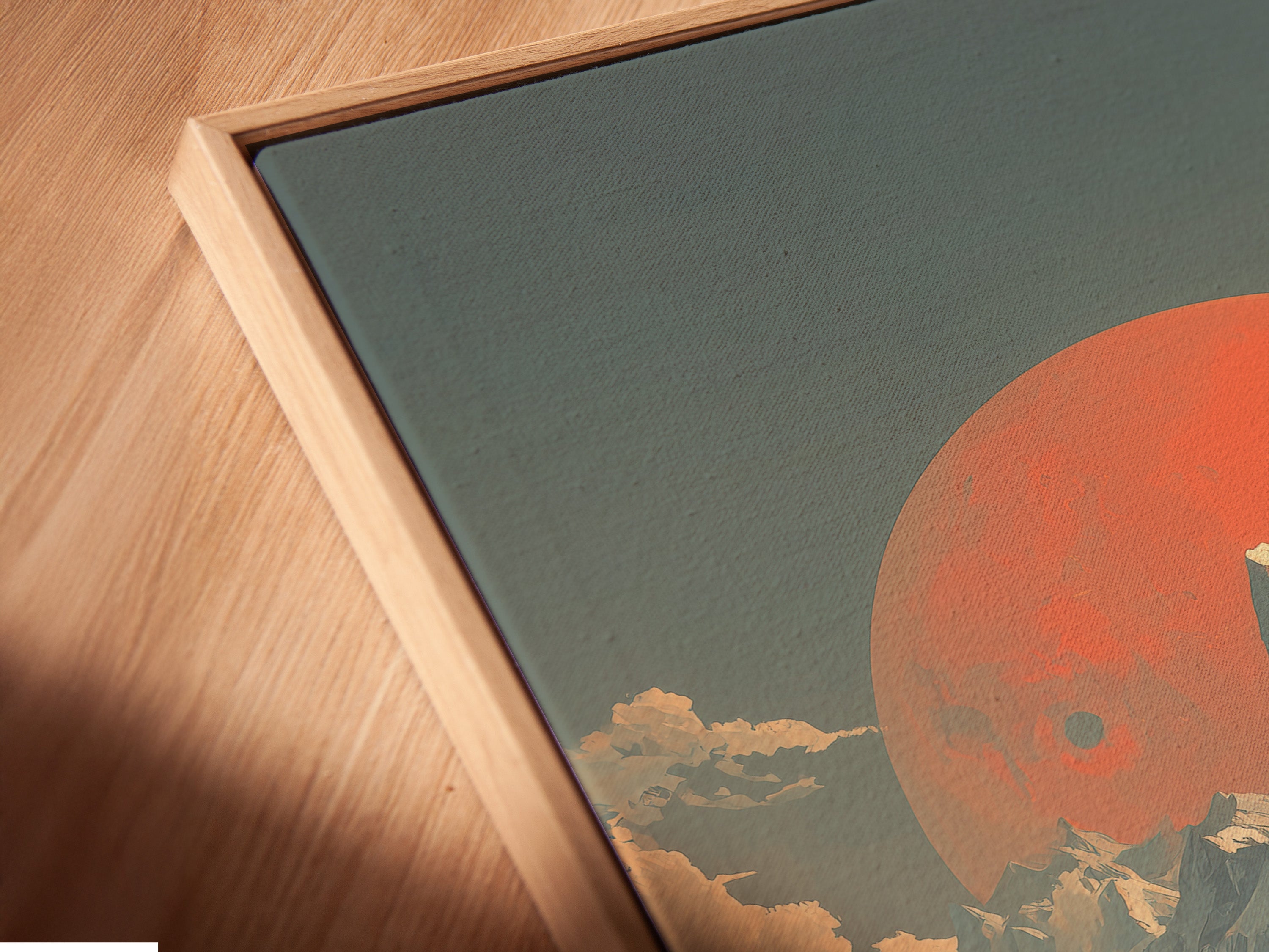 A close-up angled view of a canvas print in a floating frame. The mountain sunset artwork is vintage. The alpine landscape wall art gives a rustic vibe. The floating frame adds depth. The coral sun print is showcased beautifully. Add style to your decor.
