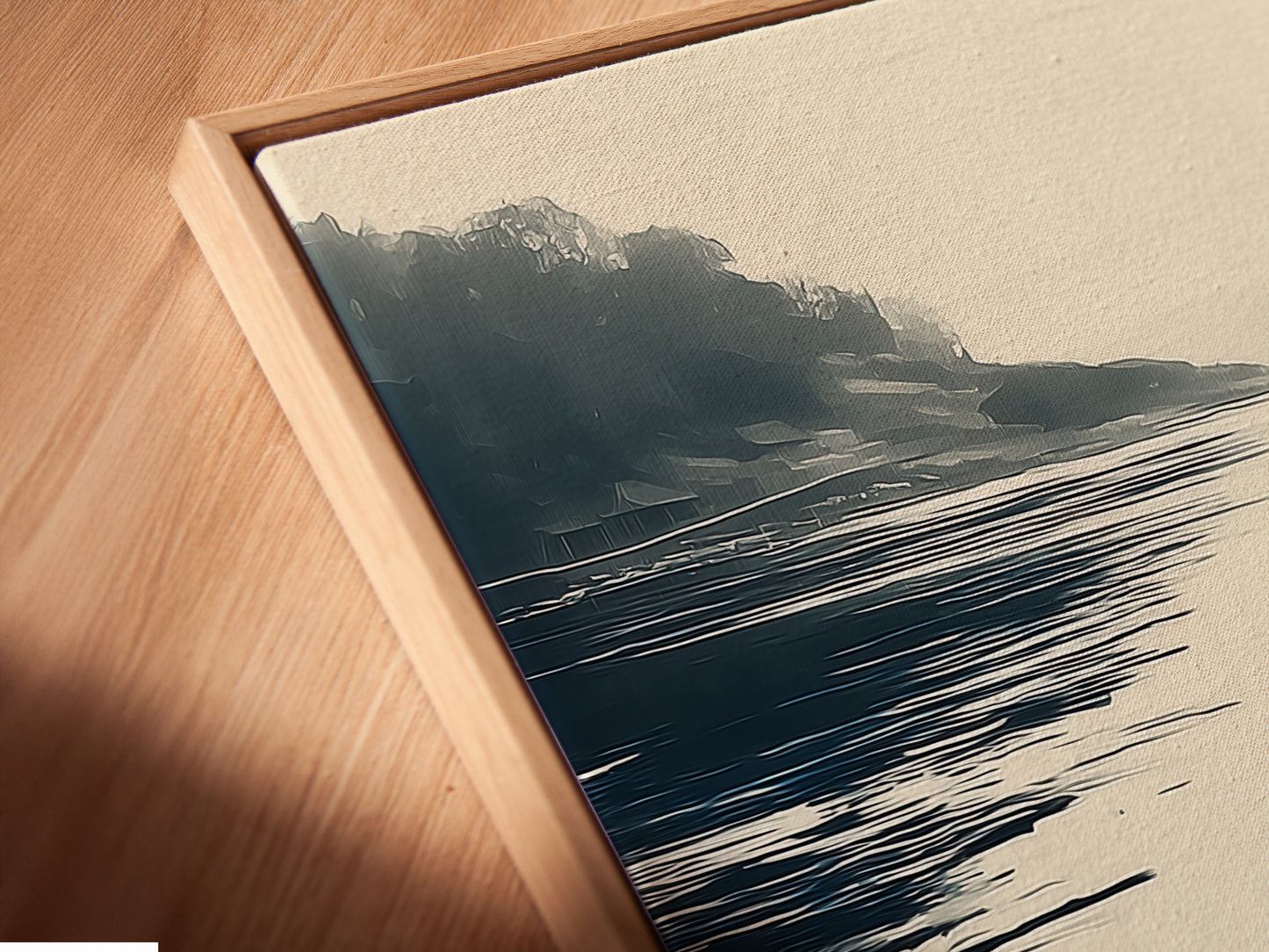 A close-up of a coastal landscape canvas print displayed in a floating frame. The serene lake art features blue and beige tones. This modern nature artwork enhances minimalist coastal and farmhouse decor. Perfect for adding a touch of refined elegance to any wall decoration. Explore the beauty of framed art.
