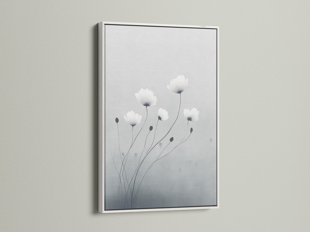 Elevate your space with minimalist flower art in a white frame. The botanical print features soft gray and white hues. This modern canvas art is perfect for bedroom wall decor. White frames create a clean contemporary look for delicate flower artwork.