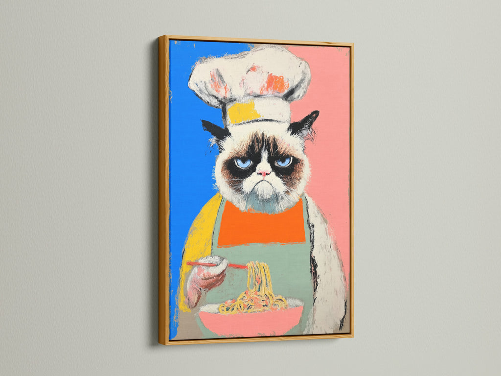 This chef cat artwork is framed in gold. This funny cat print is great kitchen wall art. The colorful pop art canvas elevates the dining room. It is perfect for modern eclectic and contemporary styles.