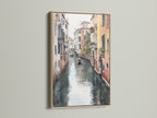Venice Canal art displayed in an oak frame. The Italian watercolor artwork brings a touch of European cityscape to your dining room decor. Notice the gondola art and vintage cityscape details.