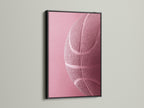 Black frame on a wall. The black frame features a pink basketball art print. A black frame adds a touch of sophistication to any artwork. Its ideal for creating a bold statement in your space. Explore the impact of framed art.