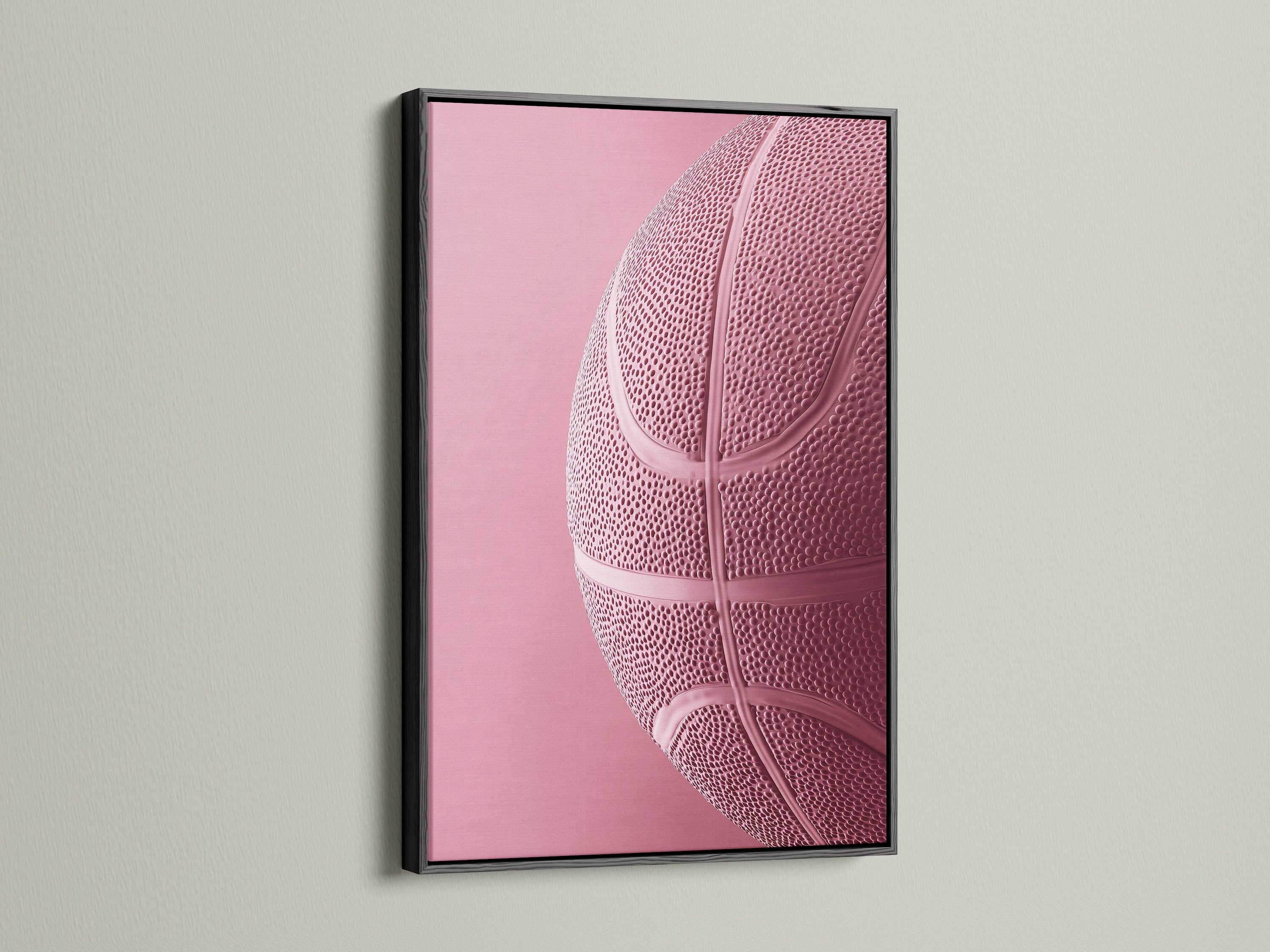 Black frame on a wall. The black frame features a pink basketball art print. A black frame adds a touch of sophistication to any artwork. Its ideal for creating a bold statement in your space. Explore the impact of framed art.