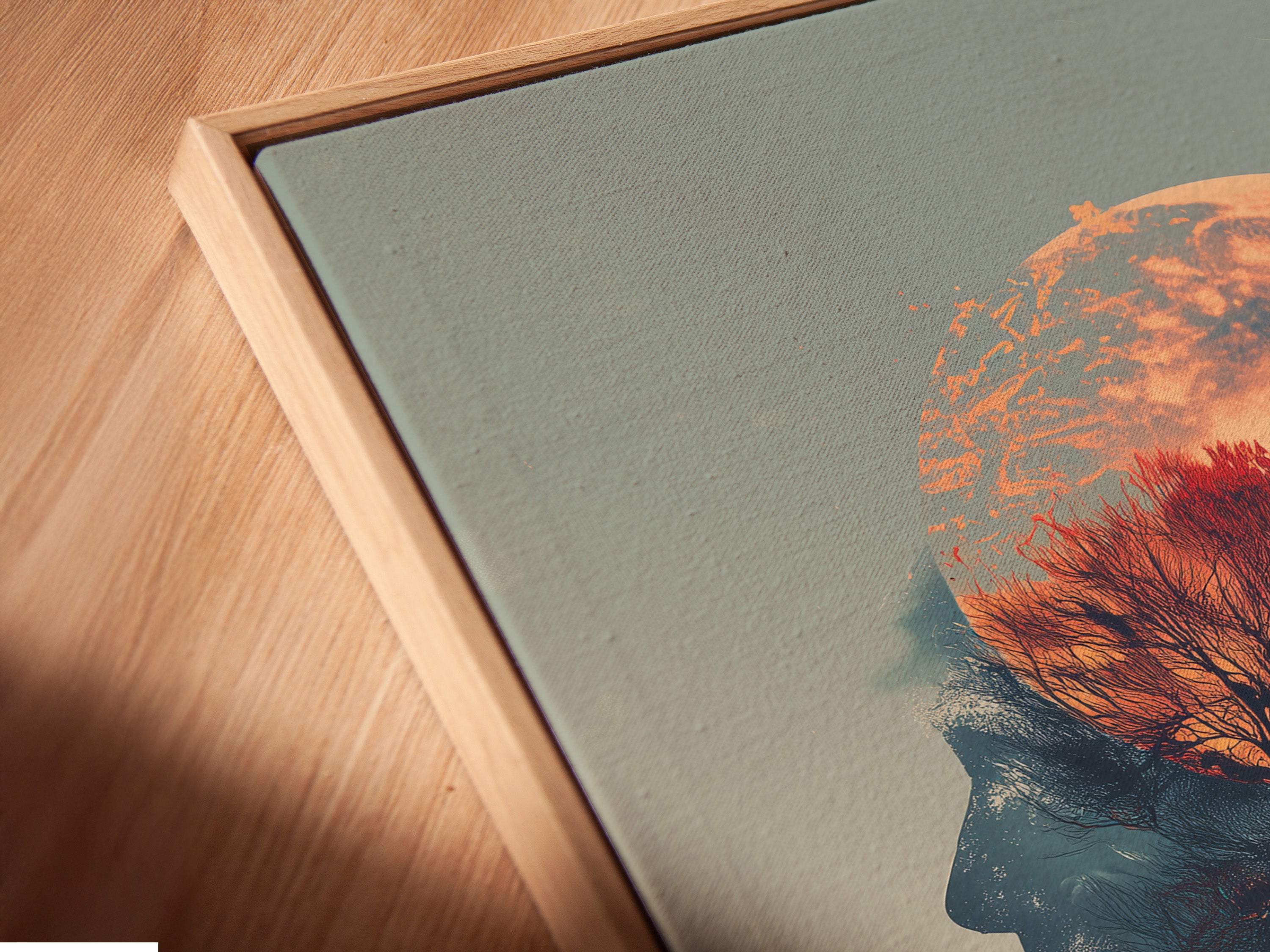 A close-up shows a canvas print in a floating frame. This artwork features a woman silhouette a moon and a tree. The surreal double exposure adds depth. This modern piece enhances any room's aesthetic appeal.