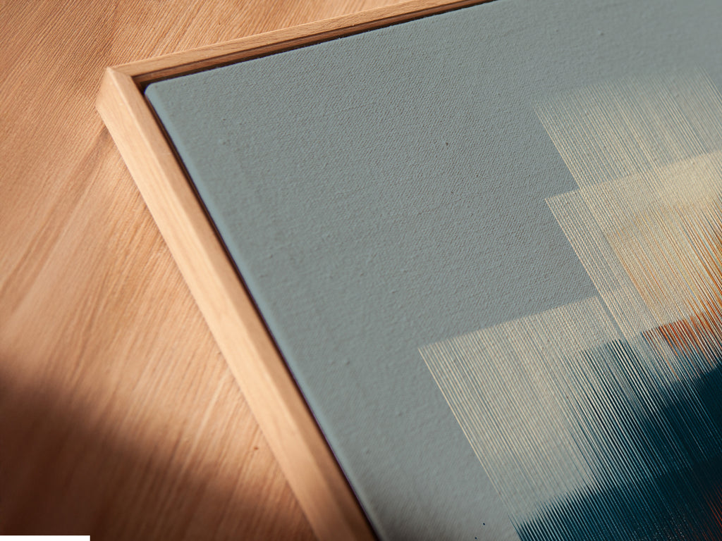 A close-up shows a canvas print in a floating frame. The frame creates a modern gallery-like look. The artwork appears to float within the frame. This adds depth and dimension to the piece. Explore the unique appeal of floating frames. They enhance any artwork beautifully. Elevate your art with a contemporary touch.