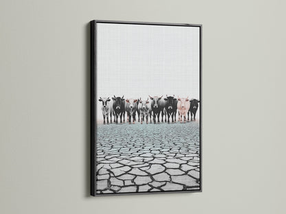 Cattle canvas print in a black frame. This rustic wall art complements any space. Black frame enhances the black and white animal canvas. Elevate your decor with black framed art.