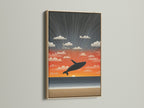 Whale Sunset beach wall artwork in an oak frame. The oak frame provides a natural and warm touch. This frame enhances the coastal aesthetic. It makes a great addition to any room.
