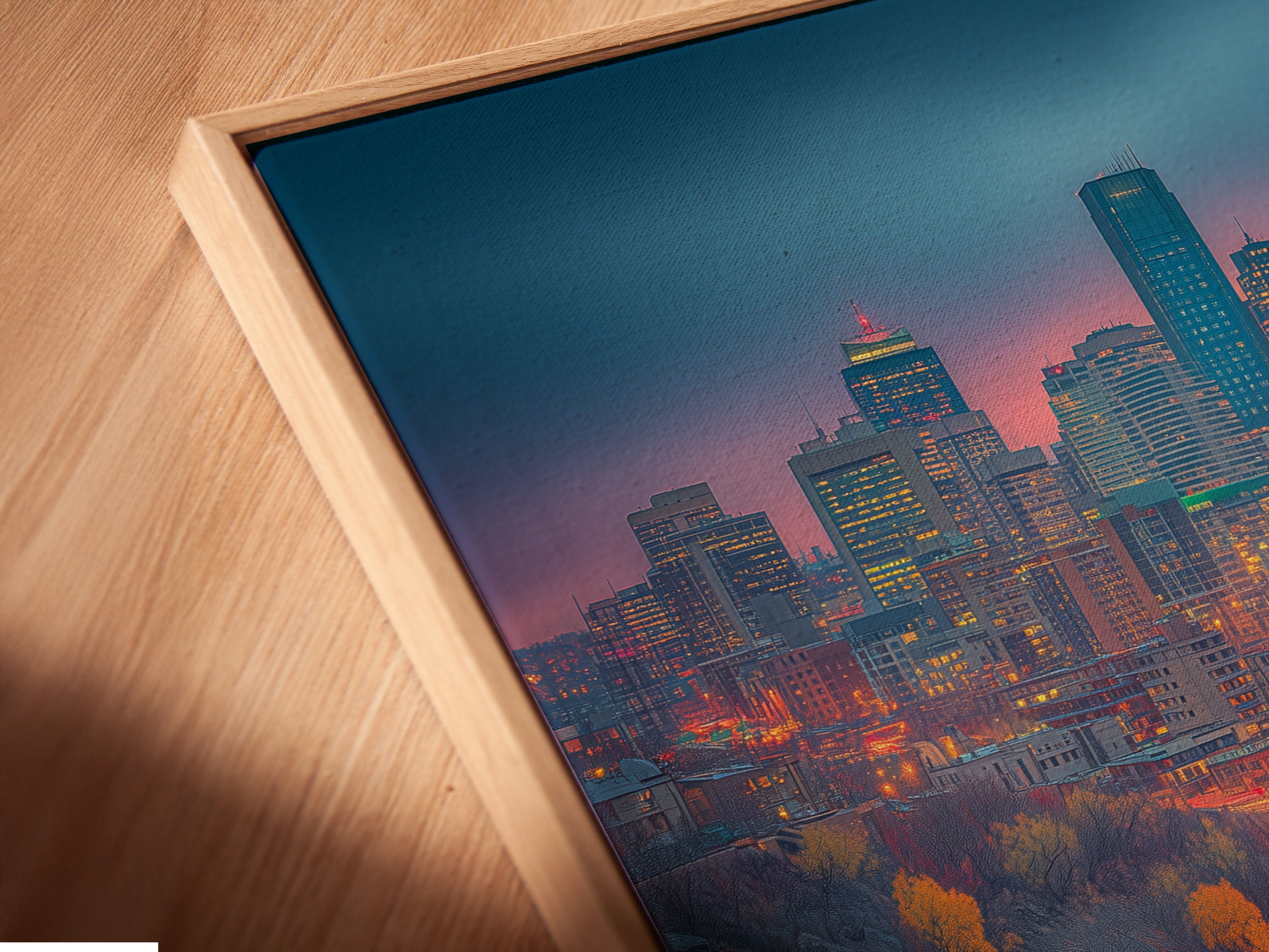 A close-up of a canvas print in a floating frame. The cityscape artwork features urban photography with teal and orange hues. This modern city art is perfect for any space. The floating frame adds a contemporary touch. Showcase your unique style