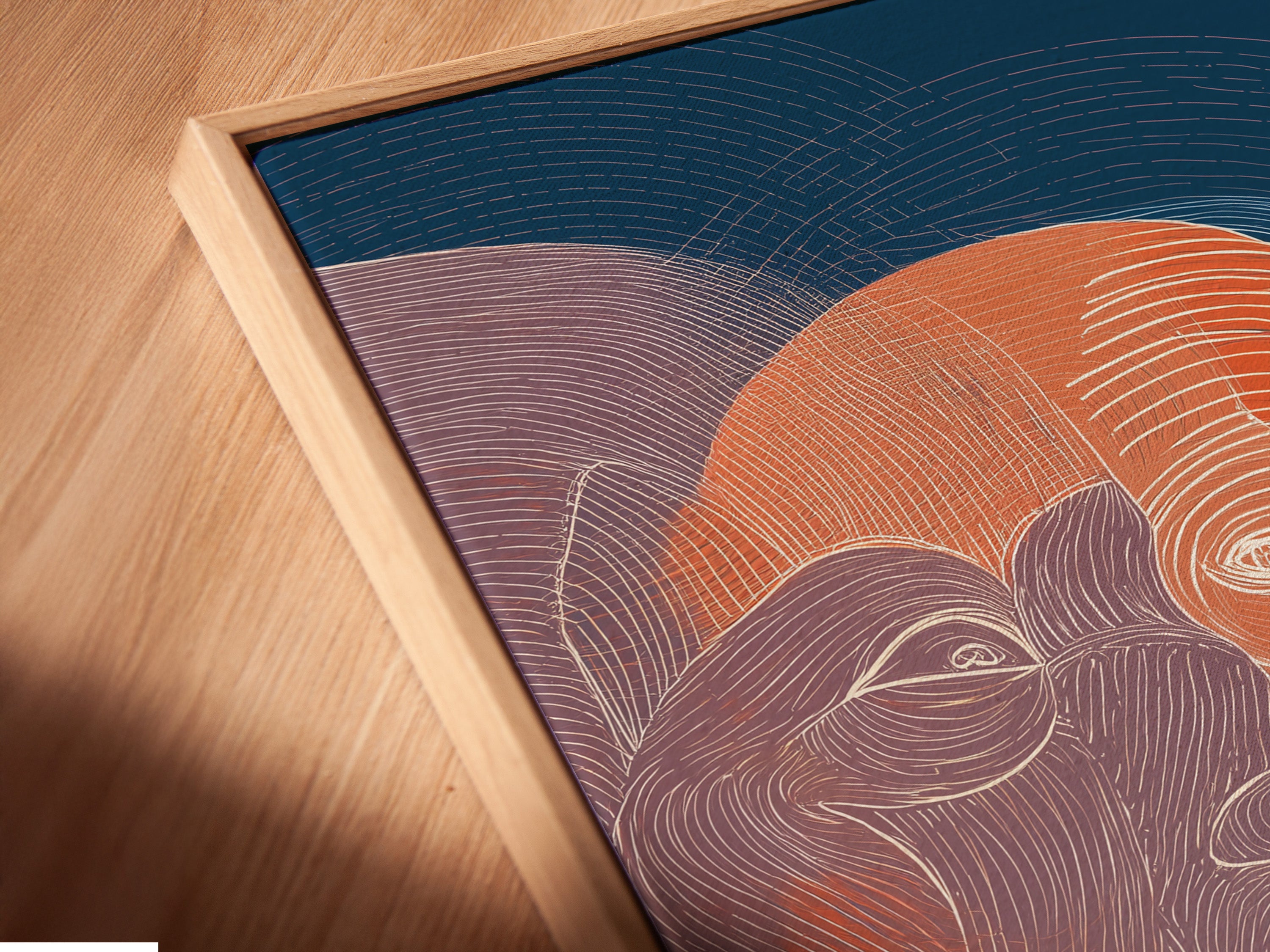 Angled close-up of a canvas print. It is in a floating frame. The floating frame creates a modern and minimalist look. It gives the illusion that the canvas is floating within the frame.