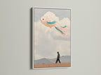A white frame displays a surreal fish kite artwork. This dreamy wall art is a whimsical print. It's perfect for kids room decor or playroom art. The fantasy art adds a colorful touch.