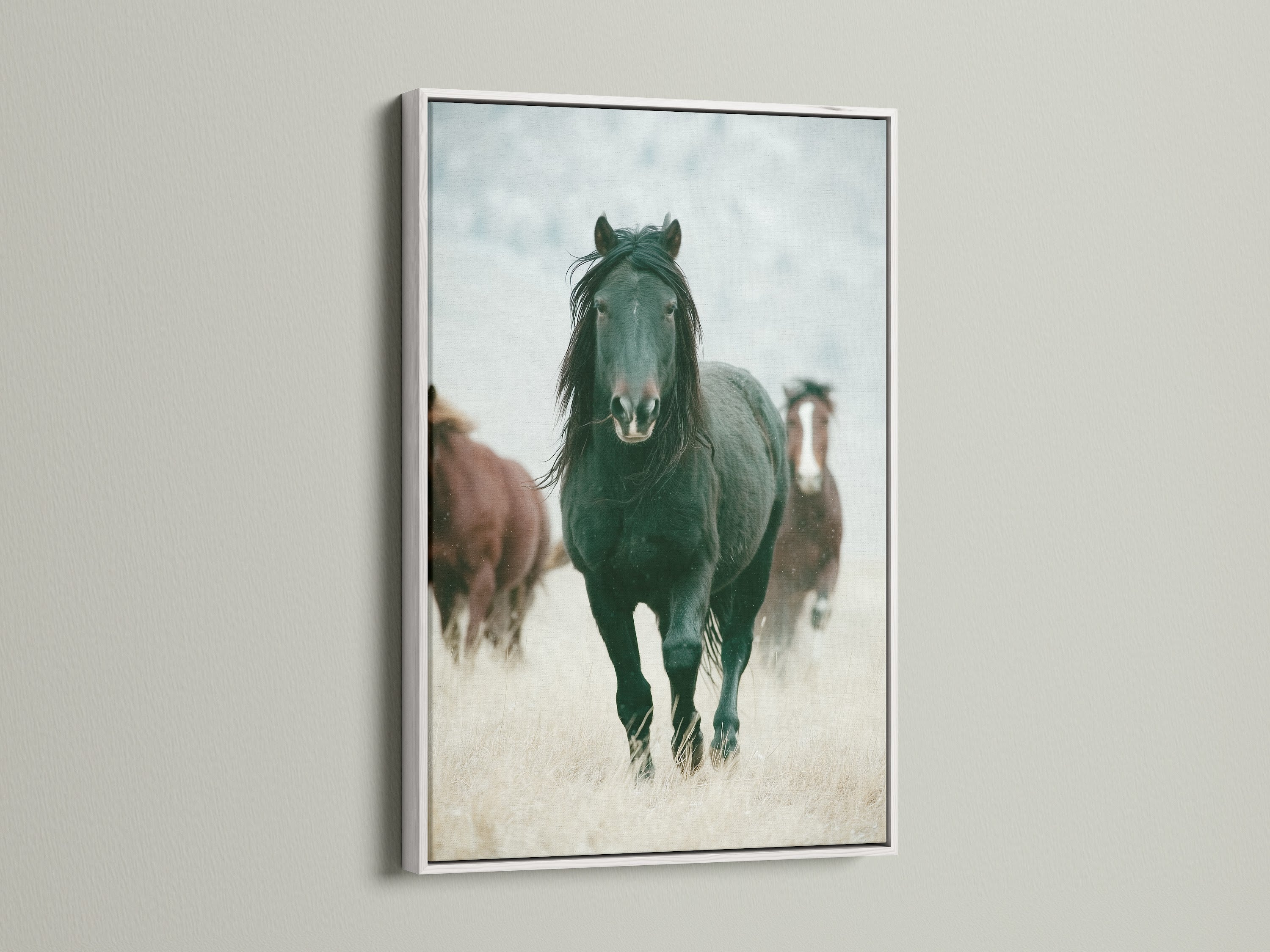 Wild horses artwork in a white frame. This rustic artwork adds a touch of the Wild West to any room. Perfect for living rooms bedrooms or offices seeking a country or farmhouse style. This artwork is great for ranchers or anyone that appreciates wildlife art. The white frame complements any color scheme.