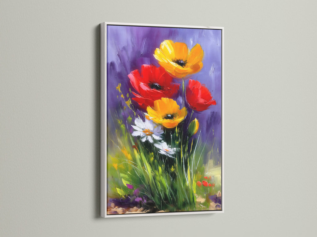 This is a framed floral artwork in a white frame. The art piece features a mix of colorful flowers. The white frame provides a clean modern look. It allows the artwork's colors to truly pop.