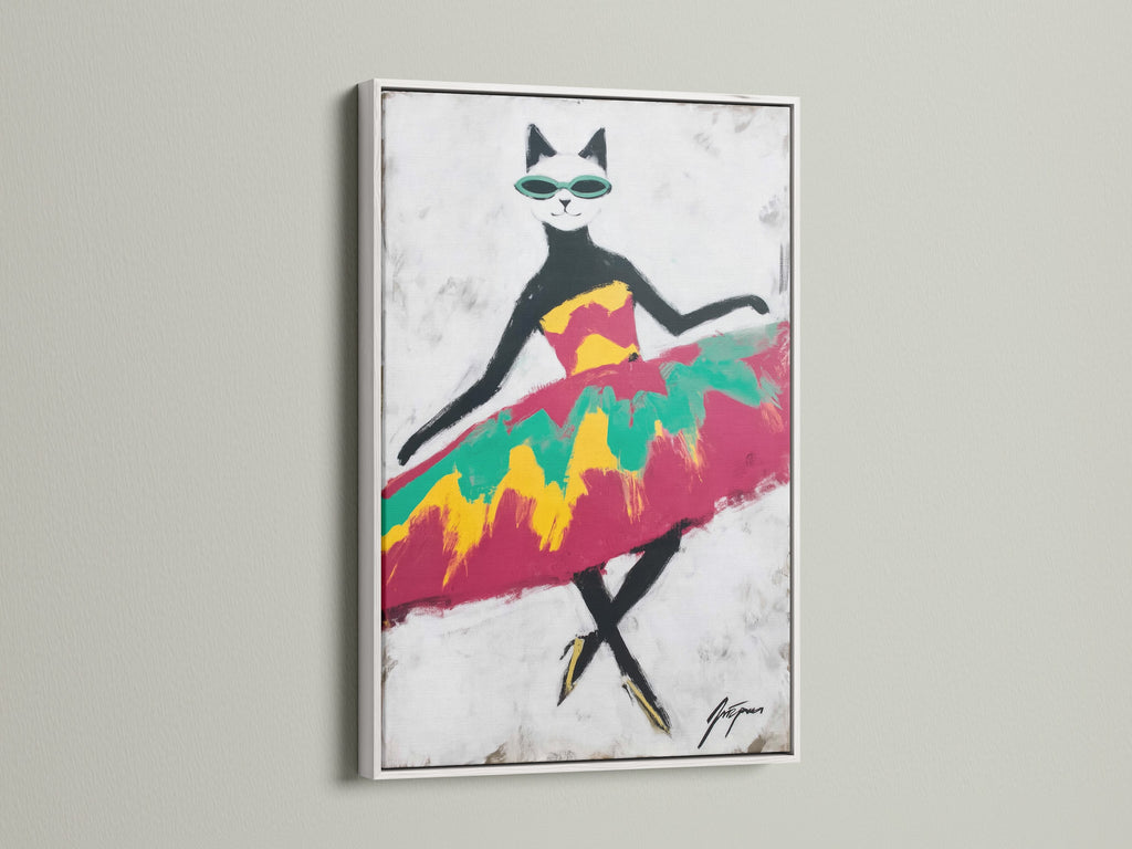 The Cool Cat Art Print is featured in a white frame. The white frame provides a clean modern look. The artwork is perfect for kids' room art. The colorful cat print offers a bright touch. It's great as animal wall decor.
