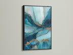 The abstract blue and gold artwork is displayed in a sleek black frame. The contrast accentuates the fluid teal marble patterns. This contemporary art piece makes a bold statement. Perfect for adding a touch of sophistication to any room. Its versatile style complements both modern and minimalist interiors.