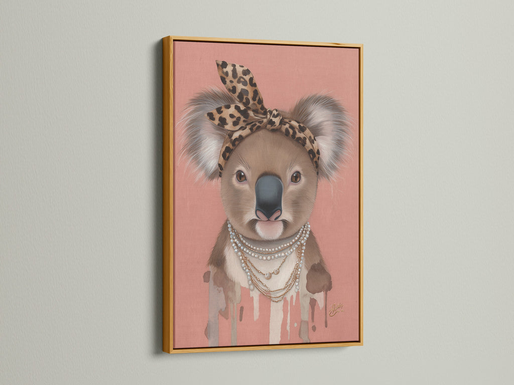 Gold Frame features the Koala Wall Art. This animal canvas print is ideal for nurseries and eclectic spaces. The Koala wears a leopard print headband and pearl necklace. It is a cute and stylish animal artwork.