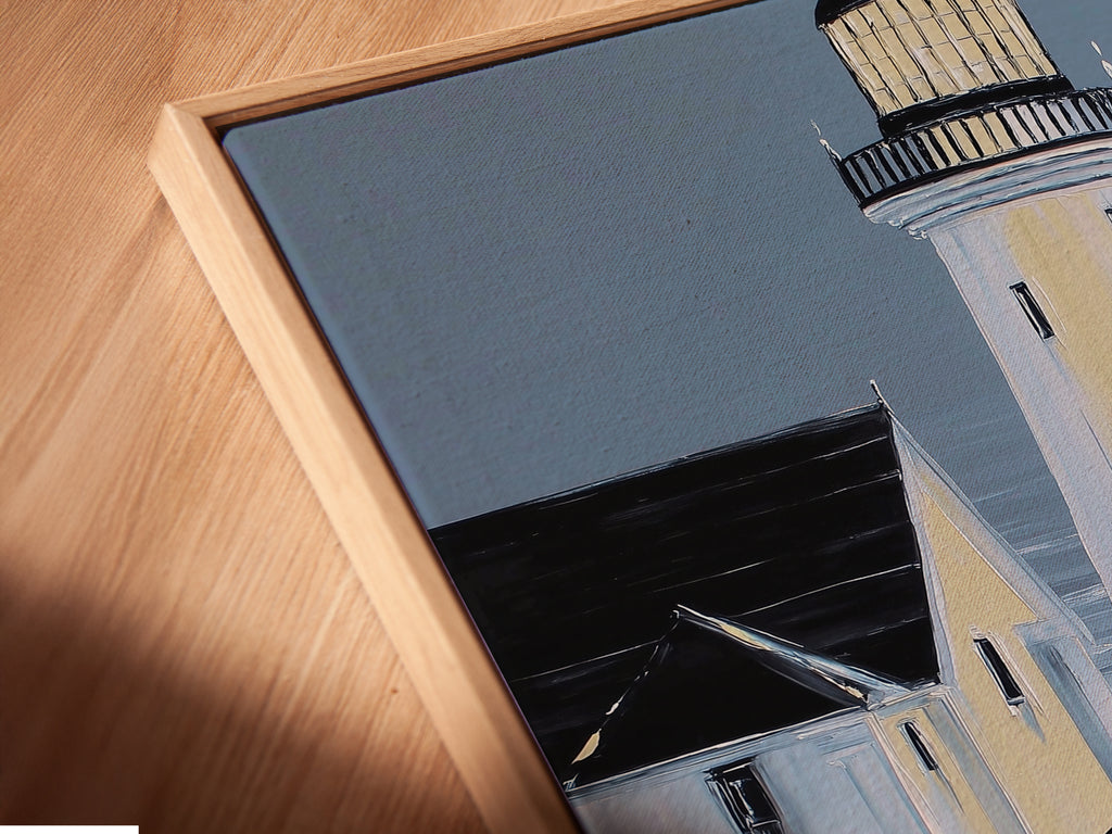 Angled close up of a canvas print in a floating frame. This lighthouse artwork is perfect for home or office. The floating frame adds depth and sophistication. It is an ideal choice for interior designers.