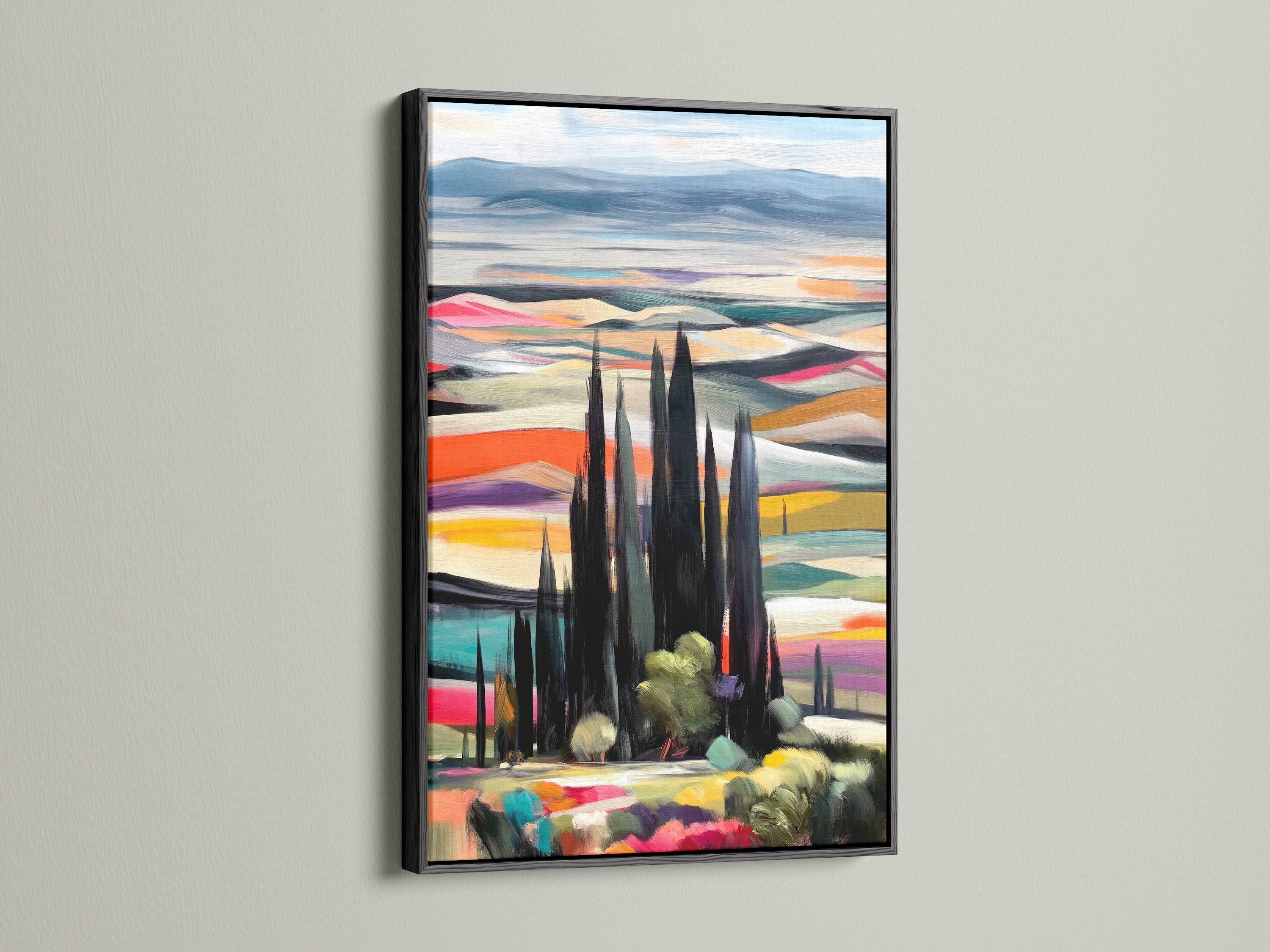 A modern Tuscan Landscape artwork is elegantly framed in black. This Italian art print features cypress trees and a colorful countryside. The black frame adds a touch of sophistication. Perfect for living room wall art or bedroom wall decor. Bring the beauty of Tuscany to your home.