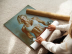A woman is carefully rolling a fine art poster paper of the Fitness Motivation artwork. This poster features a strong woman. The fine art paper ensures high-quality prints. Great for fitness enthusiasts and gym owners.