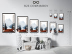 A size comparison chart is displayed in an interior setting. The artwork features a mountain view through an open window. This nature landscape print is available in various sizes. Perfect for home wall decor. Choose the ideal size to enhance your living room bedroom or office space with a calming scenic print.