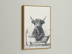 Highland Cow Canvas Print in a gold frame. This farmhouse animal art adds a touch of elegance to your space. The cow in a bathtub is a funny and unique bathroom art piece. Perfect for powder room decor.