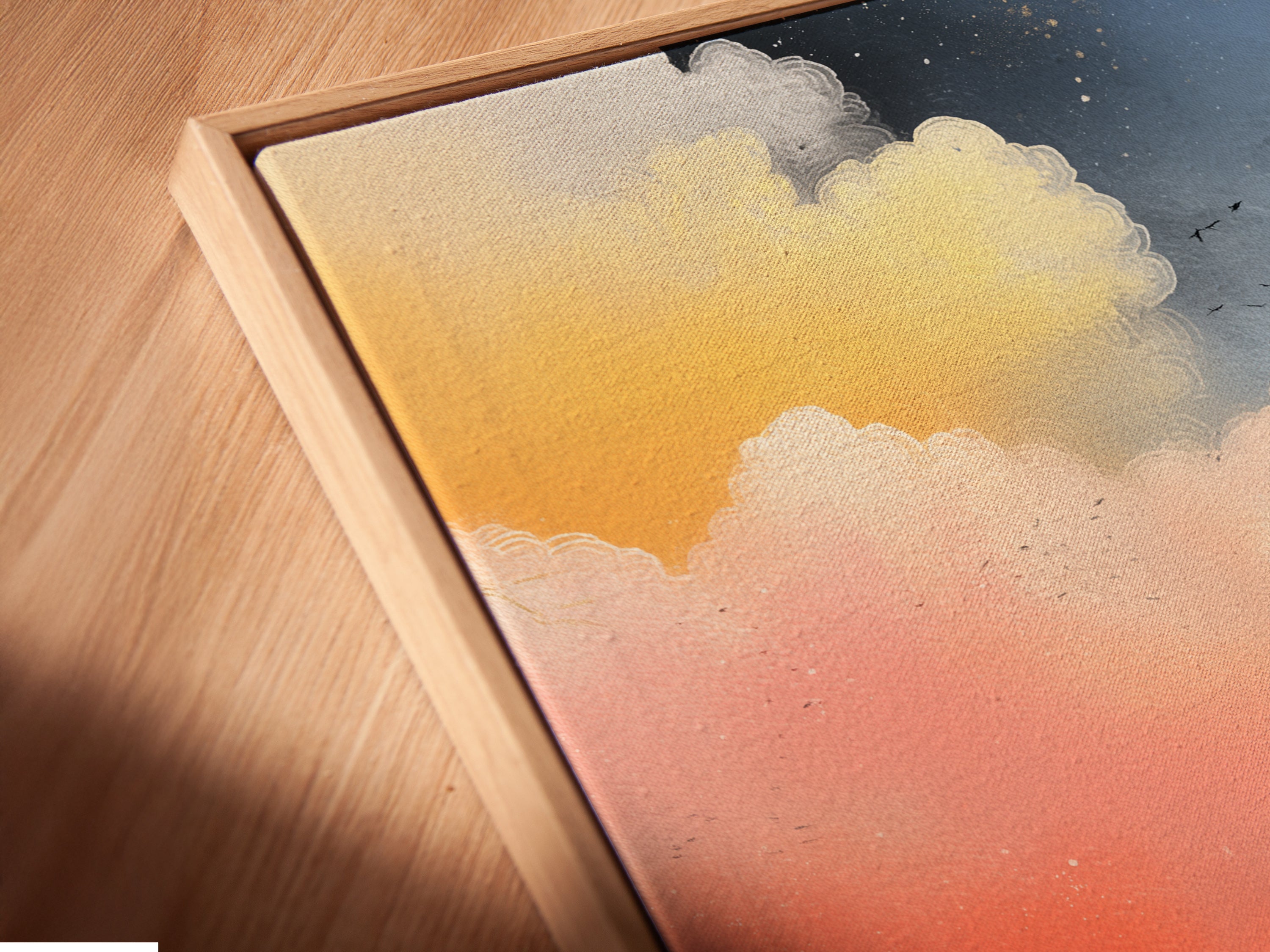 Close-up of a Sunrise Seascape canvas print in a floating frame. The abstract cloudscape appears elegant. This coastal wall art adds a modern touch. Perfect for art collectors and interior decor enthusiasts.