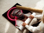 A woman rolls fine art poster paper featuring the 'Pope Monkey' design. The poster showcases surreal religious artwork. It is perfect for modern home decor. The neon halo canvas print is ready for framing. This offers a versatile wall art option.