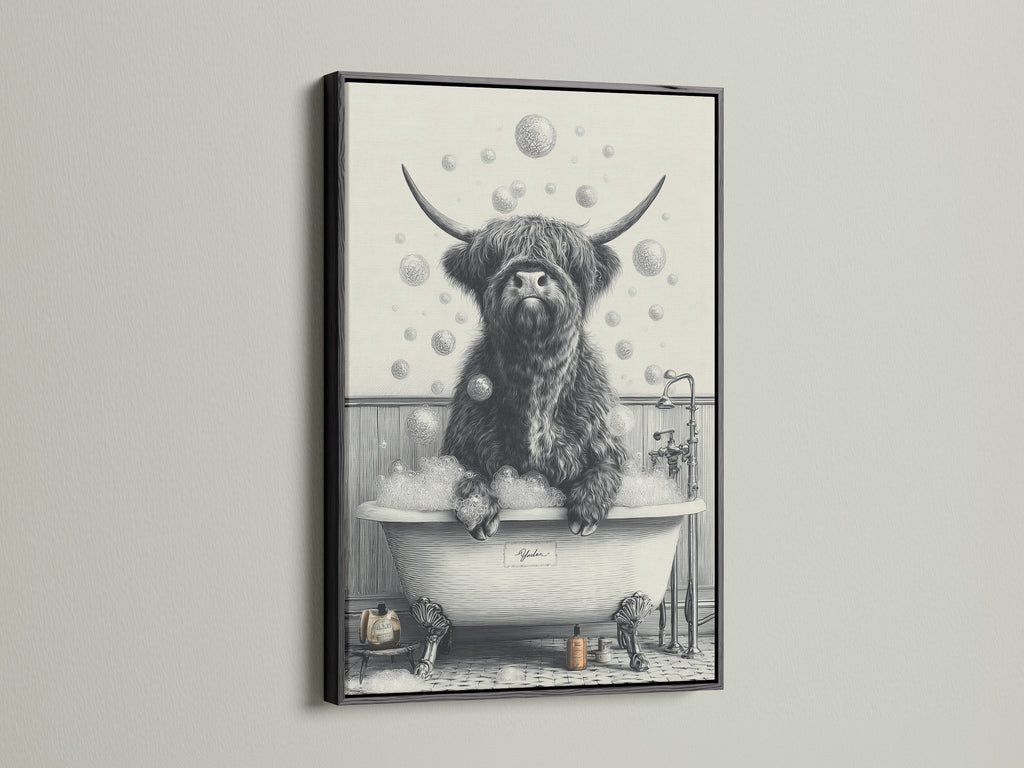 A highland cow art print is showcased in a black frame. This animal canvas art suits farmhouse decor. It's a funny animal art piece for unique wall art. A perfect addition to restroom wall decor. Enjoy this scottish cow art.