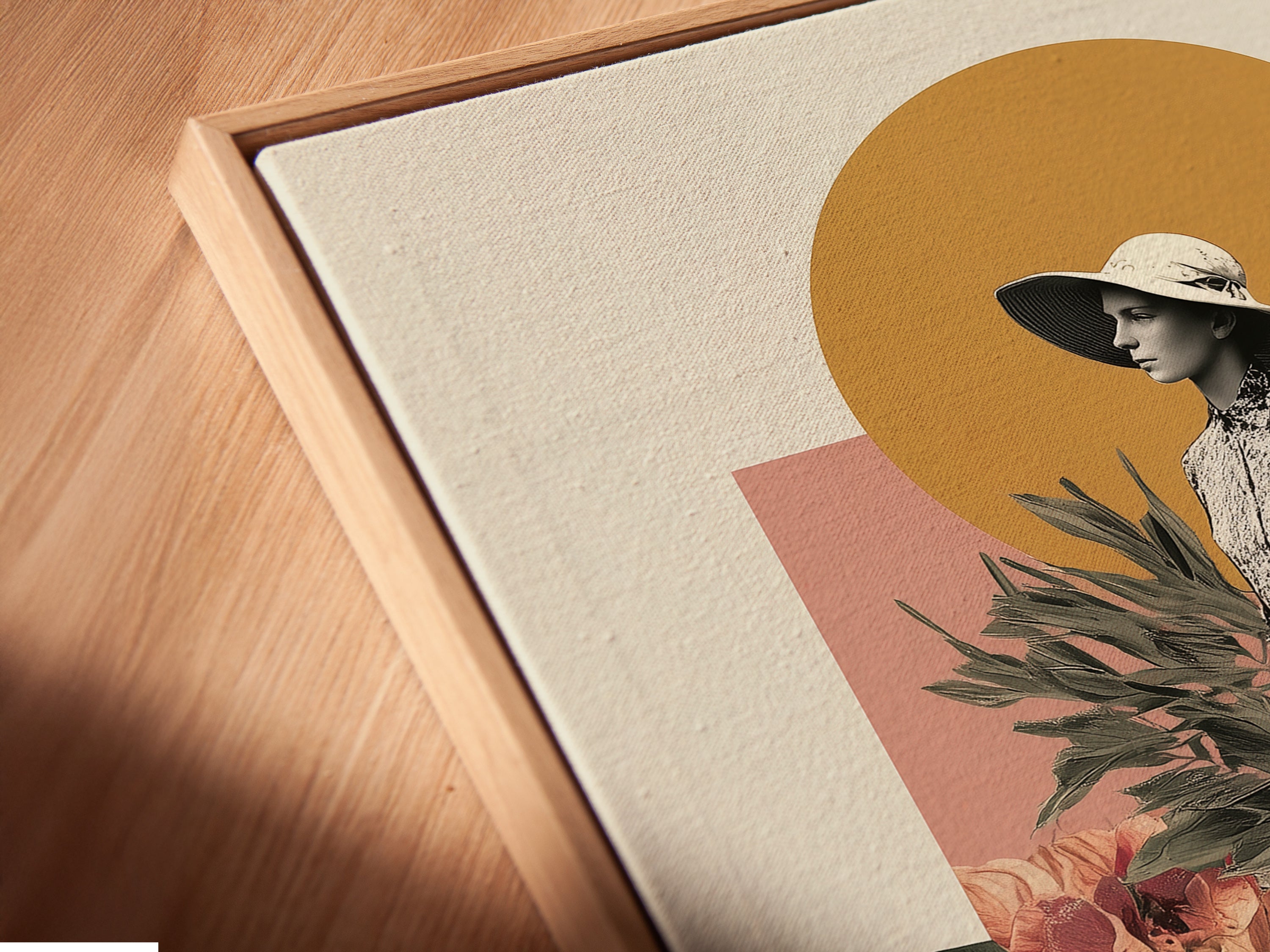 Close-up of a canvas print in a floating frame. This vintage collage art features a woman in retro fashion surrounded by botanical elements. The floating frame enhances the artwork's depth and visual appeal. Perfect for adding a touch of boho charm to your living room or bedroom wall.