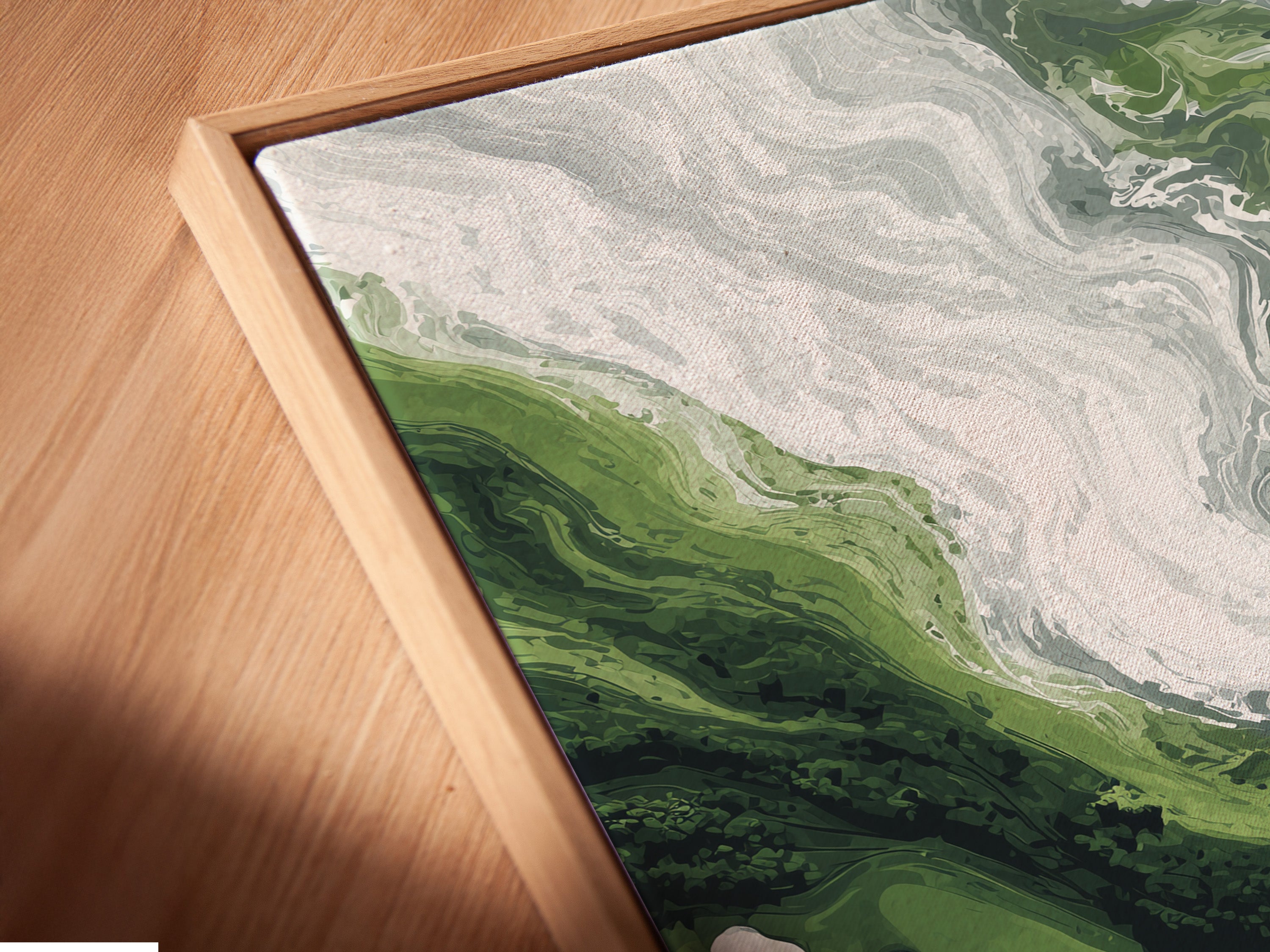 A close-up shows a canvas print in a floating frame. Green abstract art meets modern wall decor. The marble print features emerald and white swirls. This swirl artwork is perfect for contemporary spaces. Ideal for adding a touch of elegance to your home or office. Enhance your walls today.