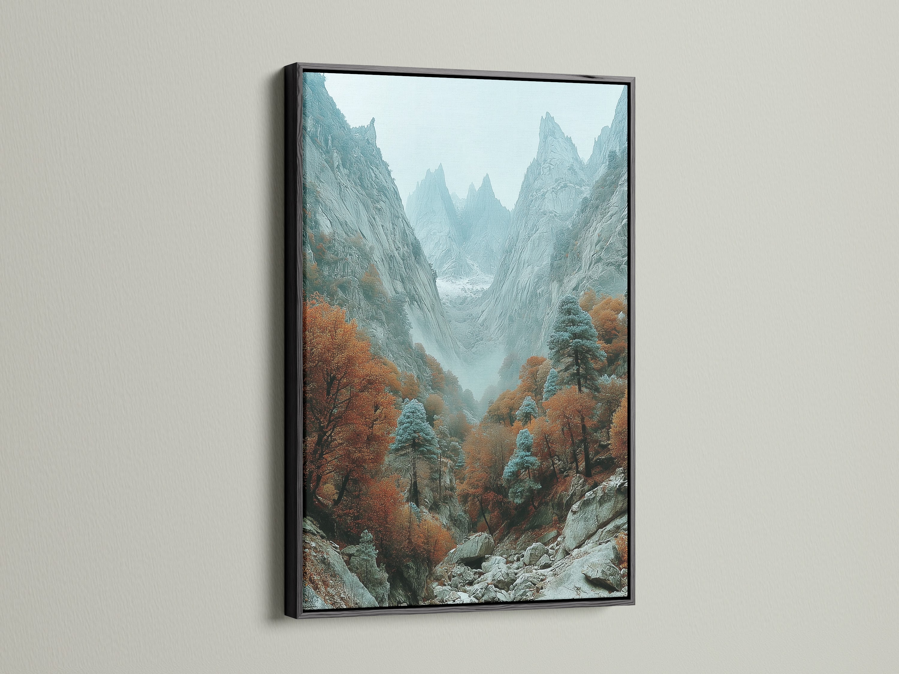Dramatic landscape featuring mountain wall decor in a black frame. The autumn landscape art captures a misty canyon scene. Ideal for adding a touch of nature to your living room or office. The black frame adds contrast.