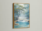 A gold frame highlights this beautiful waterfall art. The serene landscape artwork brings elegance to any room. The aqua print shines with the gold accent. Perfect for zen home decor or a stylish office.
