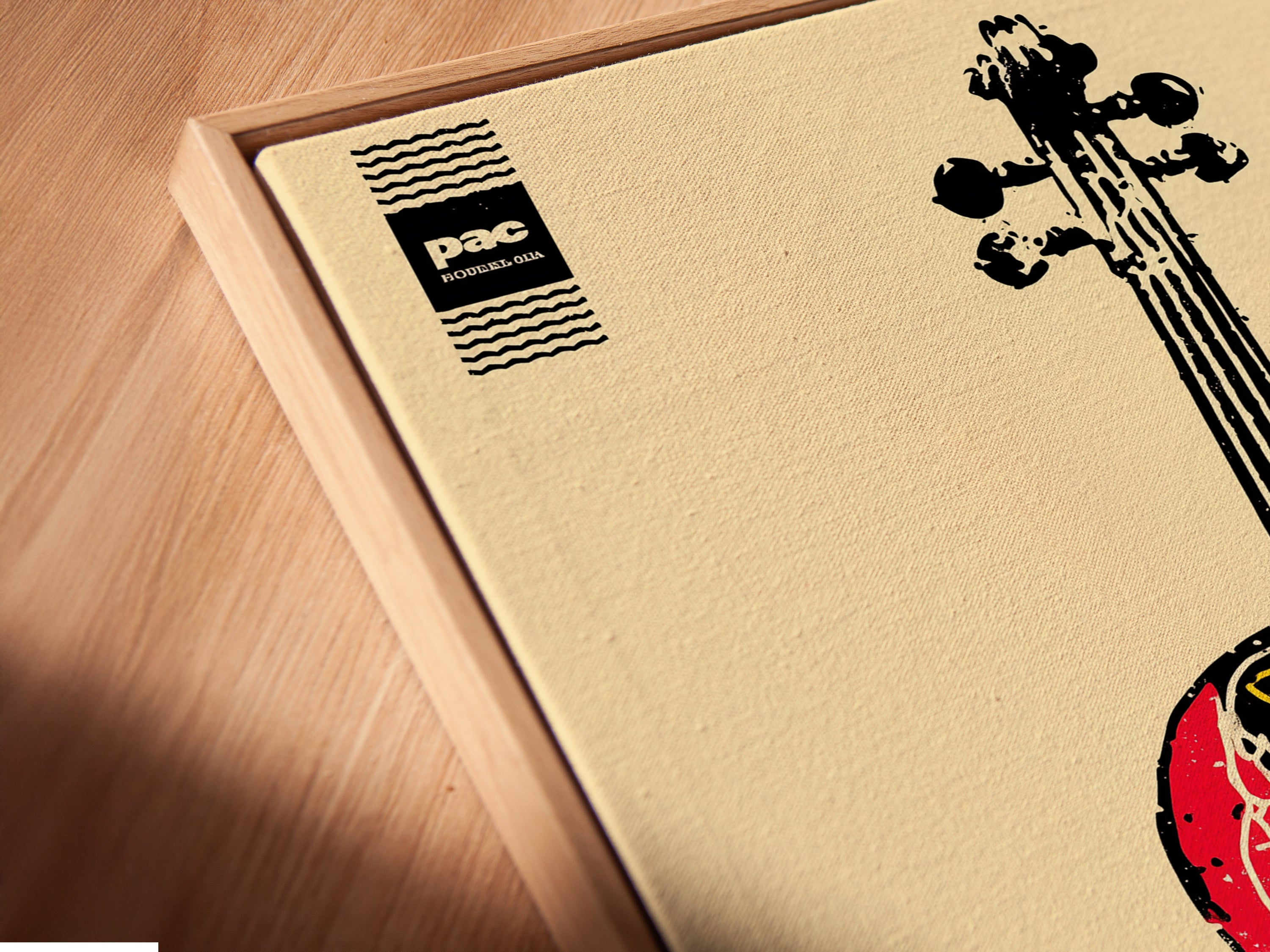 A close-up angled view of a canvas print in a floating frame. It is a violin art piece. The abstract musical instrument artwork suits any music room. This graphic artwork is perfect for a modern or eclectic style. It enhances studio wall art and band room decor.