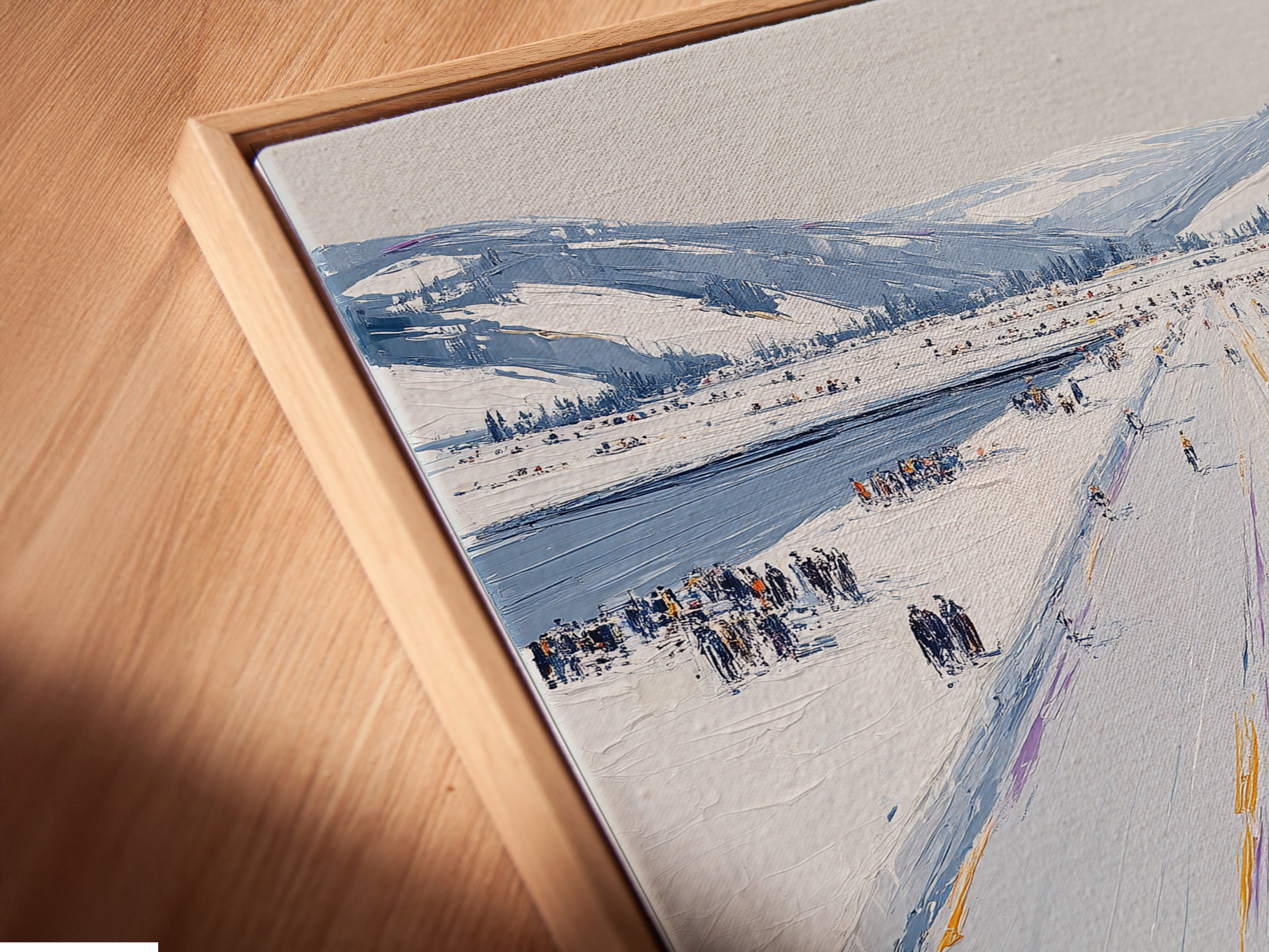 A close-up angled view shows the Winter Cityscape canvas print in a floating frame. The impressionist artwork creates a modern look. Perfect for minimalist Scandinavian coastal or industrial spaces. Elevate your office or home decor with this stylish piece.
