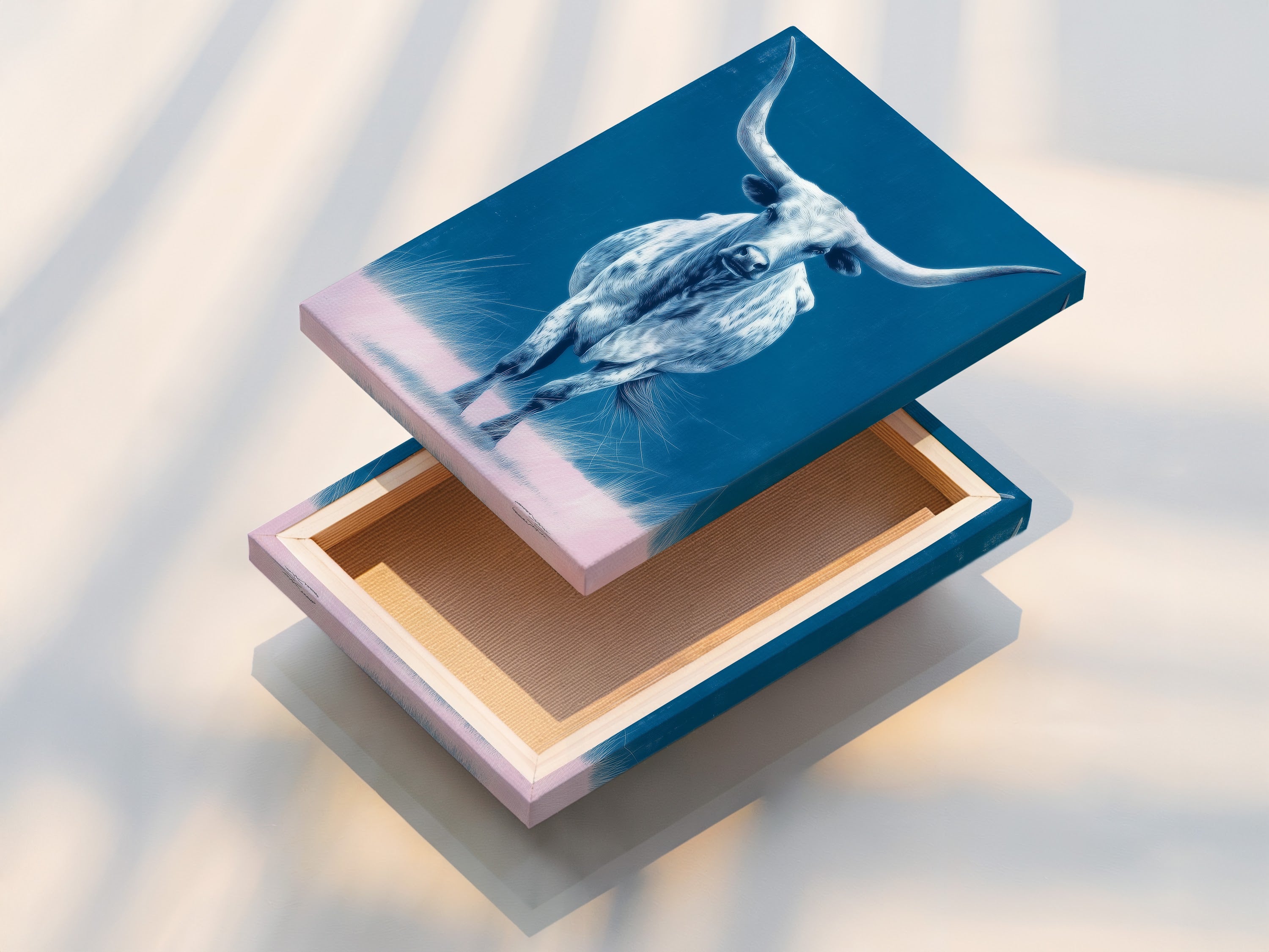 A stretched canvas print of the longhorn bull is displayed. This western ranch wall art is ready to hang. The stretched canvas ensures a gallery-quality look. Perfect for adding a touch of the west to your home.