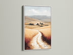 Tuscan Landscape artwork with a white frame. This countryside wall art complements any farmhouse decor. The neutral tone art highlights the Italian scenery. Featuring wheat field art this piece brings a touch of Europe to your walls. Perfect for creating a rustic ambiance.