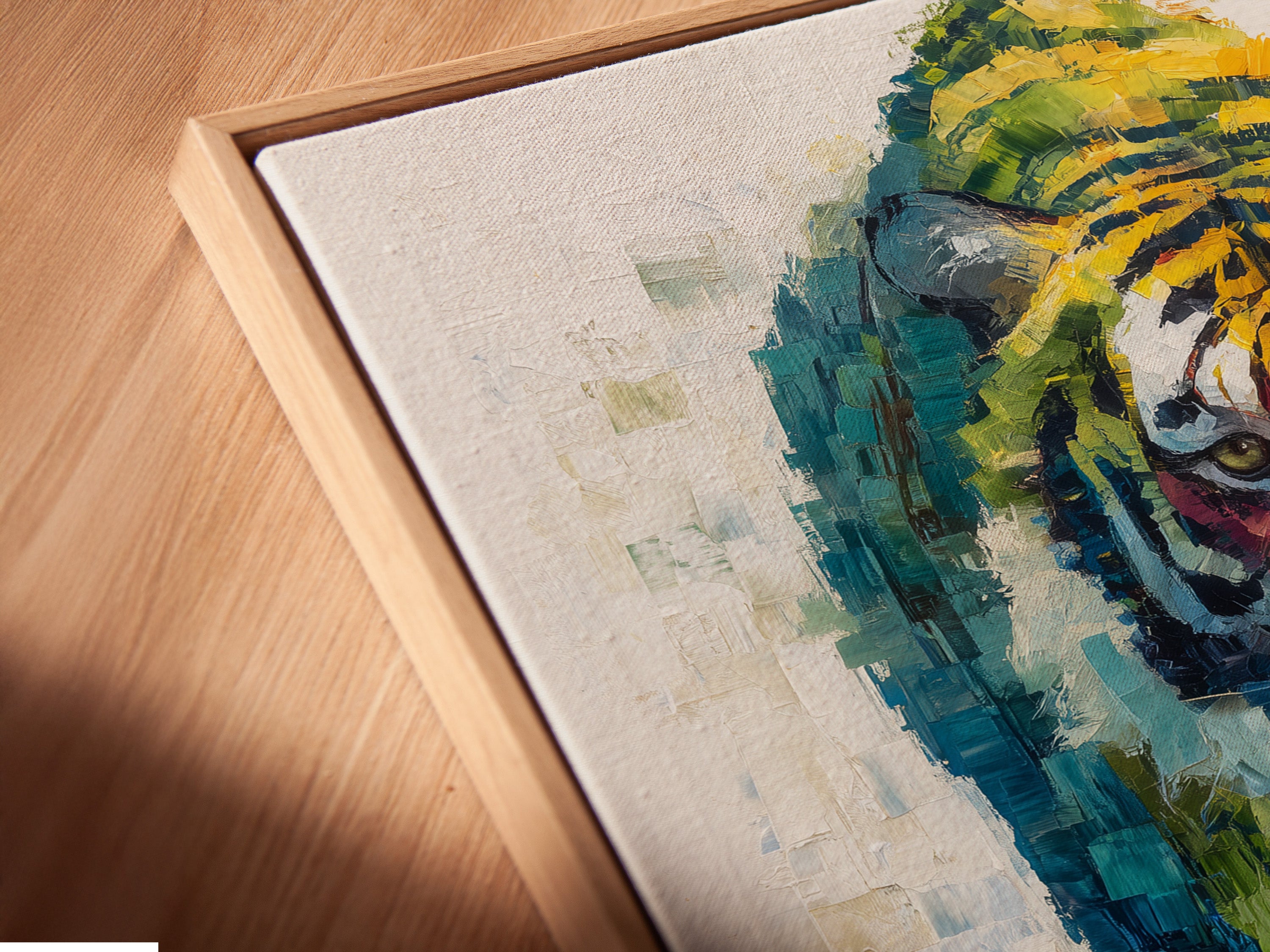 Close up of a canvas print in a floating frame. The angled view showcases the colorful tiger art. This modern animal artwork is ready to hang. A big cat print perfect for office wall art.