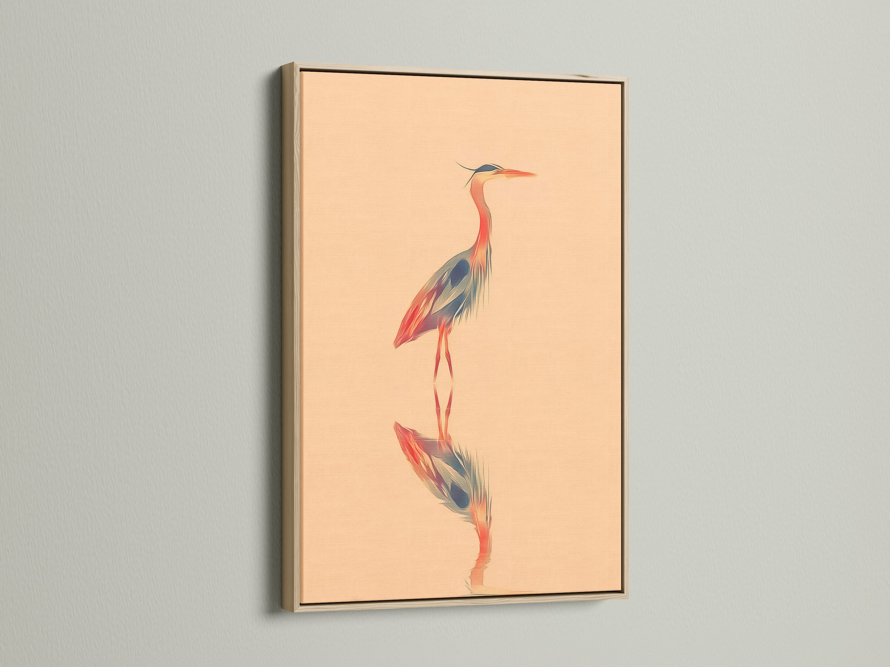 Framed heron art print. The oak frame enhances the coastal bird artwork. A peach background adds a touch of serenity. Ideal for living room wall art or bathroom decor. This nature print is a modern minimalist piece.