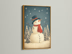 The gold frame adds elegance to this snowman art. This holiday canvas art is ideal. It's perfect for creating a cozy winter art display. This artwork enhances any Christmas prints collection.