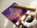 A woman is carefully rolling a fine art poster paper. This Crystal Fantasy Art Print is ready to be framed. The mystical purple landscape is perfect for any space. Get your surreal artwork today in various sizes.