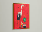 Heron Art Canvas Print in a gold frame. The red abstract wall art features a modern bird artwork. This artwork adds a luxurious touch. The gold frame enhances the artwork's vibrant colors.
