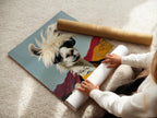 A woman carefully rolls a fine art poster paper. Preparing cool llama artwork for shipment. The quirky animal wall art features a llama with sunglasses. Perfect for trendy wall decor.