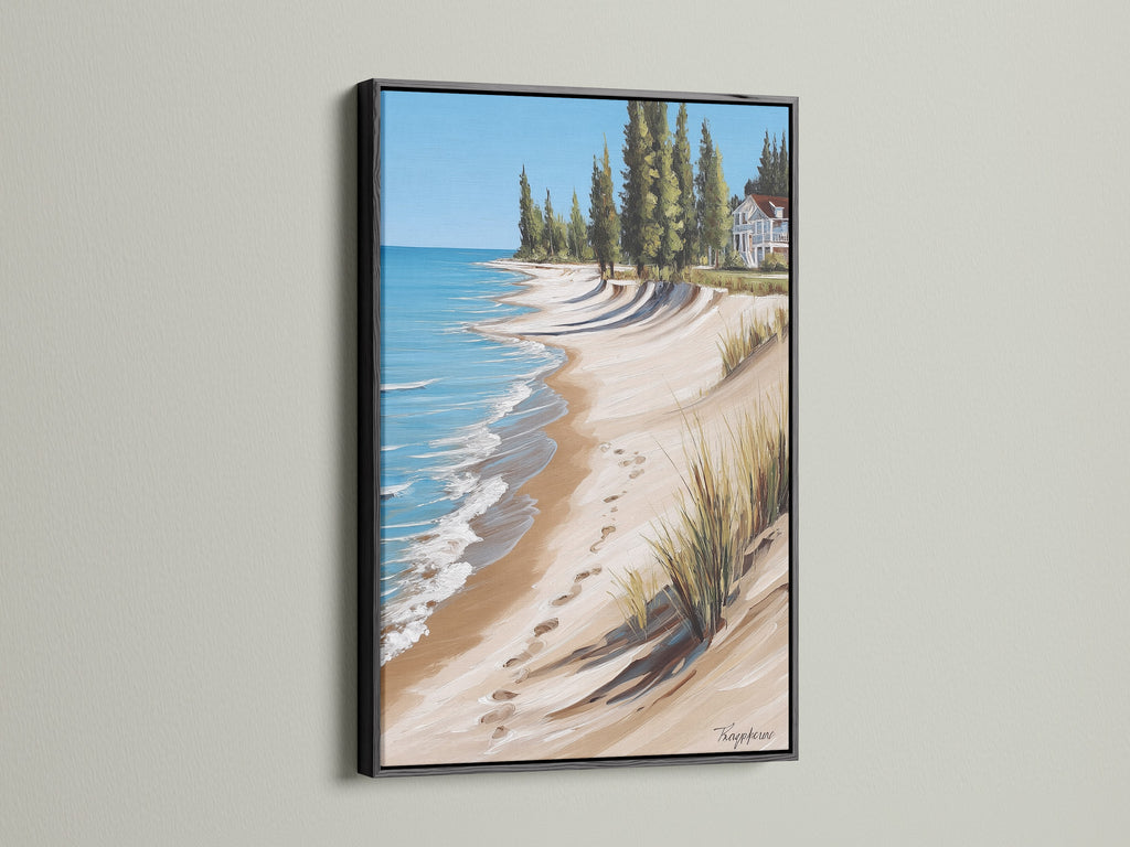 Coastal Beach House Artwork in a Black Frame. This artwork presents a stunning ocean view with a sandy shoreline. Offers a sophisticated touch to beach themed art. Suitable for traditional styles and vacation rentals.