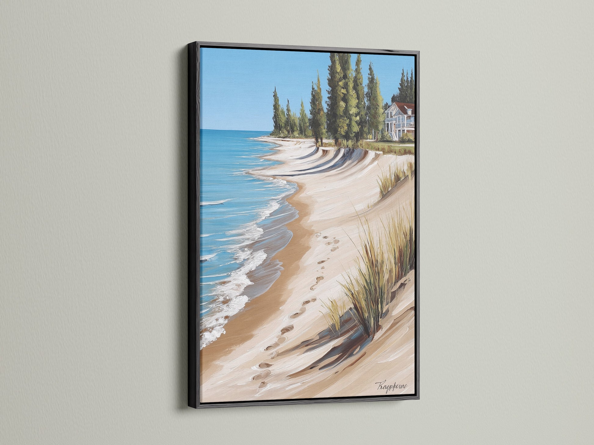 Coastal Beach House Artwork in a Black Frame. This artwork presents a stunning ocean view with a sandy shoreline. Offers a sophisticated touch to beach themed art. Suitable for traditional styles and vacation rentals.